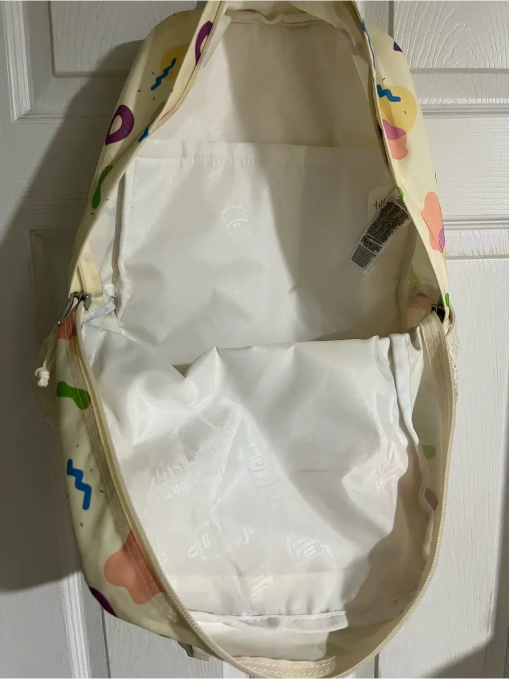 Jansport Cream Backpack with Multicolor Geometric Print